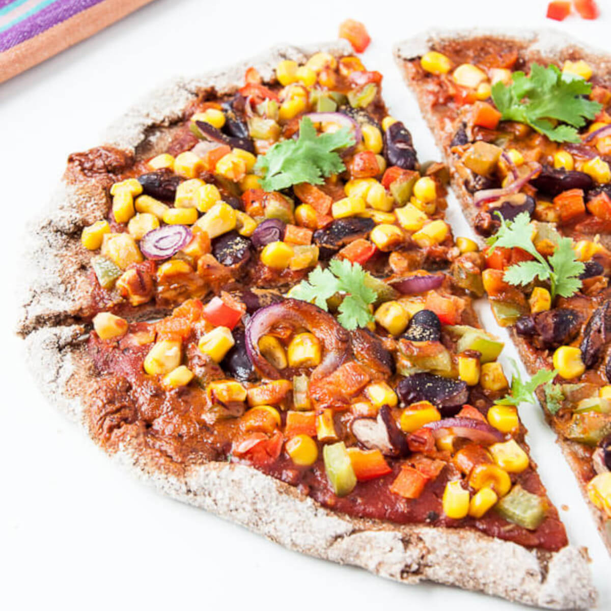 Spicy Chipotle Vegan Pizza Recipe with bell peppers, tomatoes, corn, beans and chipotle peppers - Vegan Family Recipes