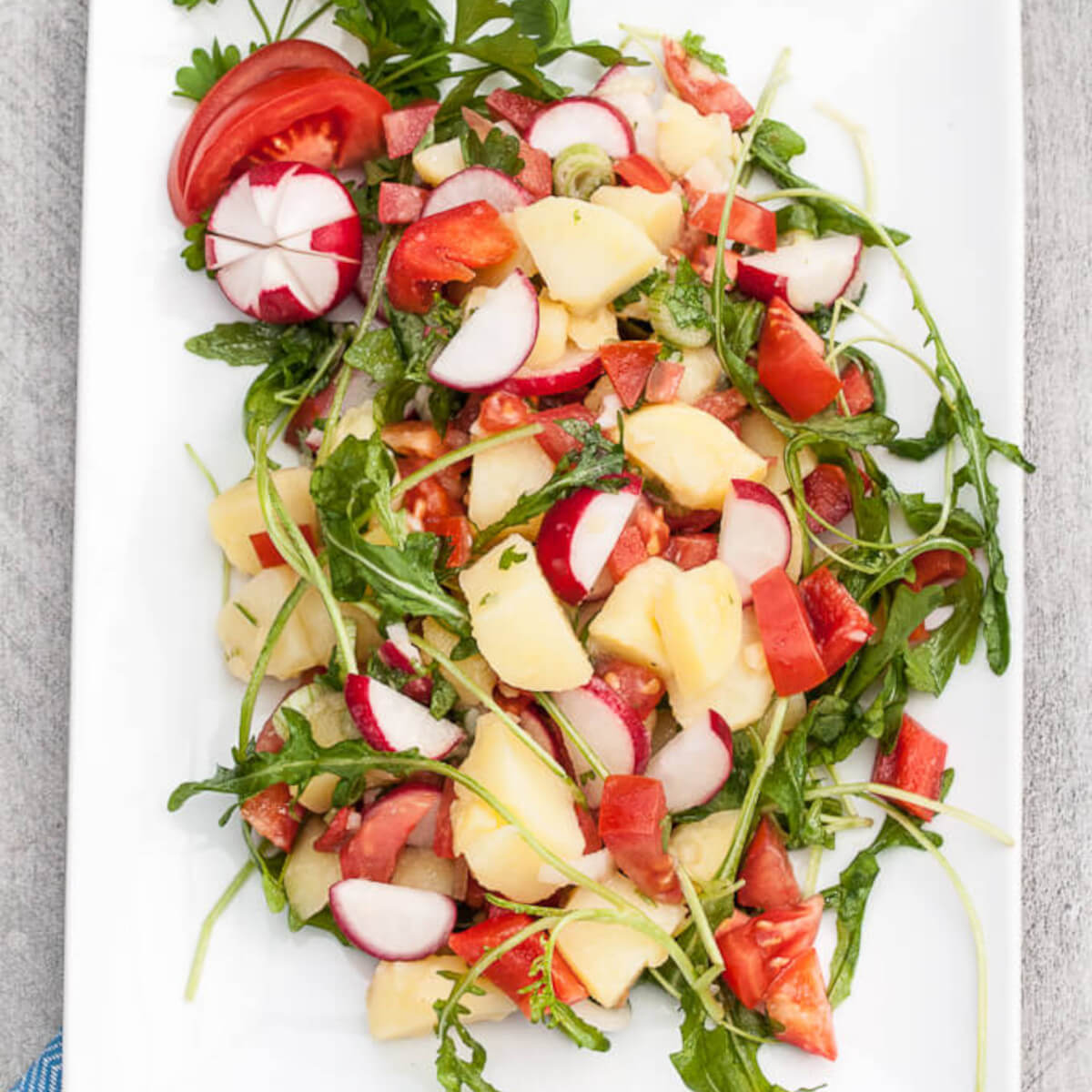Healthy Vegetable Potato Salad Recipe w/ Bell peppers, tomatoes, radishes, arugula and more! No mayo ;) - VeganFamilyRecipes.com - #vegetables #potatoes