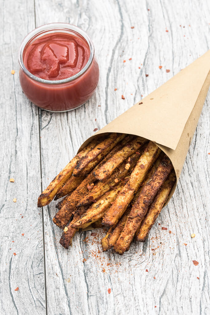 Baked Cajun Fries Recipe - Crispy, oven baked, spicy french fries! - VeganFamilyRecipes.com #healthy #potatoes #vegan