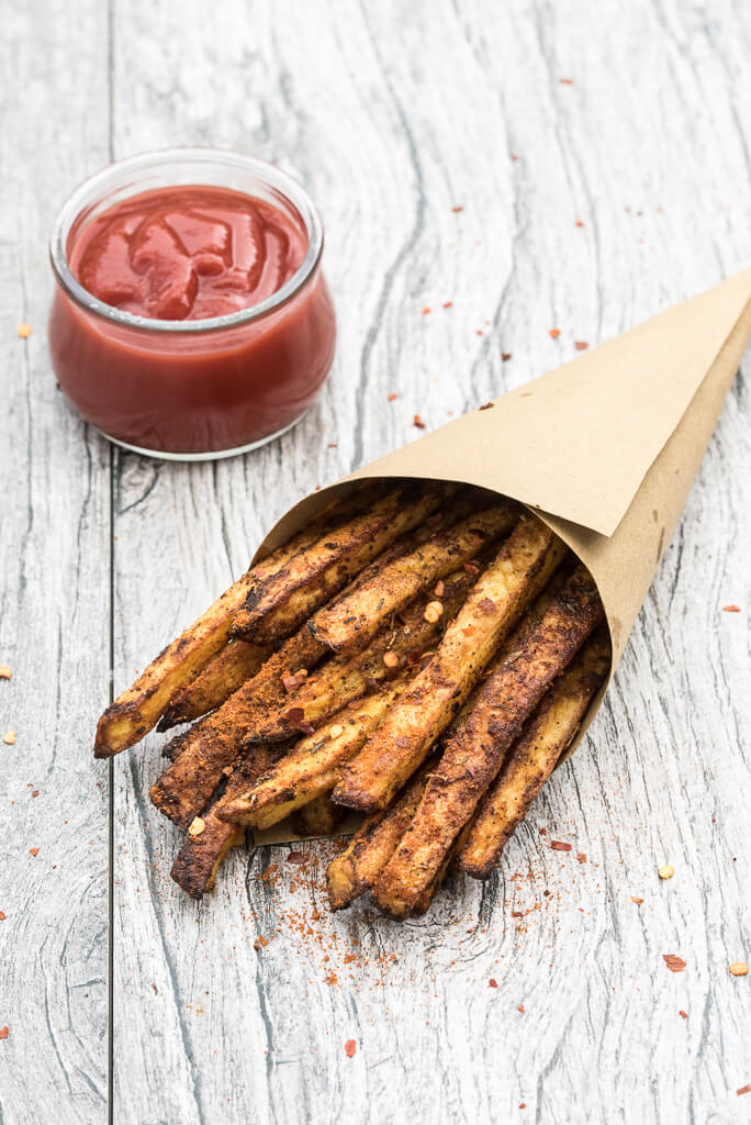 Baked Cajun Fries Recipe - Crispy, oven baked, spicy french fries! - VeganFamilyRecipes.com #healthy #potatoes #vegan