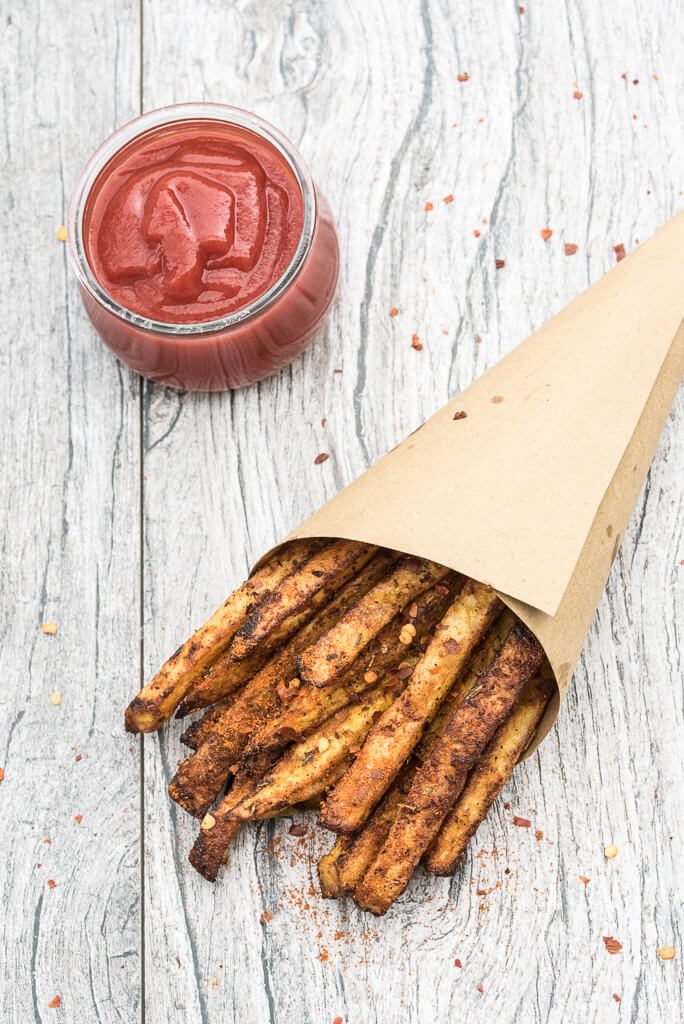 Baked Cajun Fries Recipe - Crispy, oven baked, spicy french fries! - VeganFamilyRecipes.com #healthy #potatoes #vegan