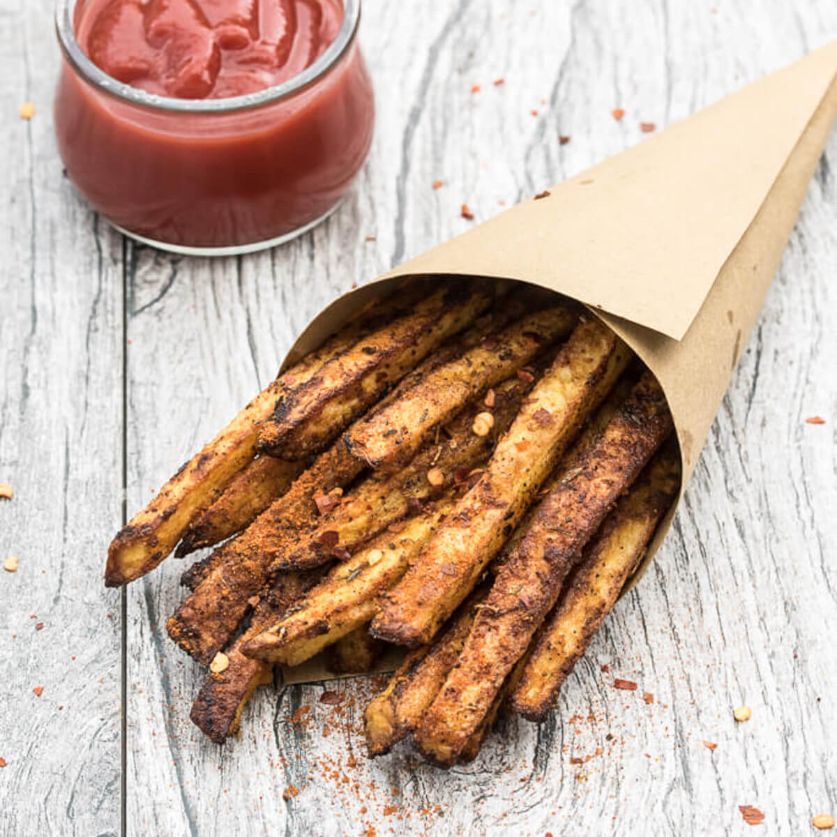 Baked Cajun Fries Recipe - Crispy, oven baked, spicy french fries! - VeganFamilyRecipes.com #healthy #potatoes #vegan